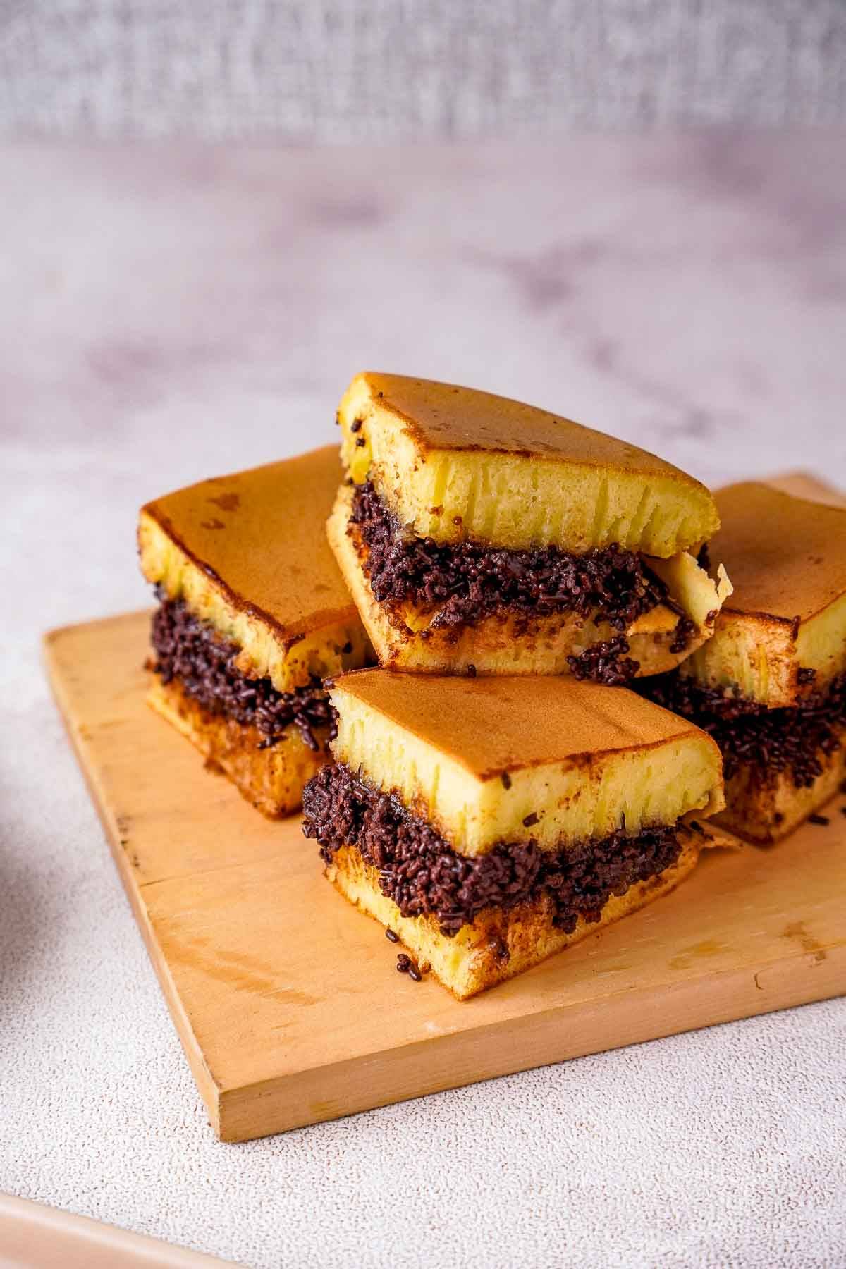 Martabak manis on a wooden platter