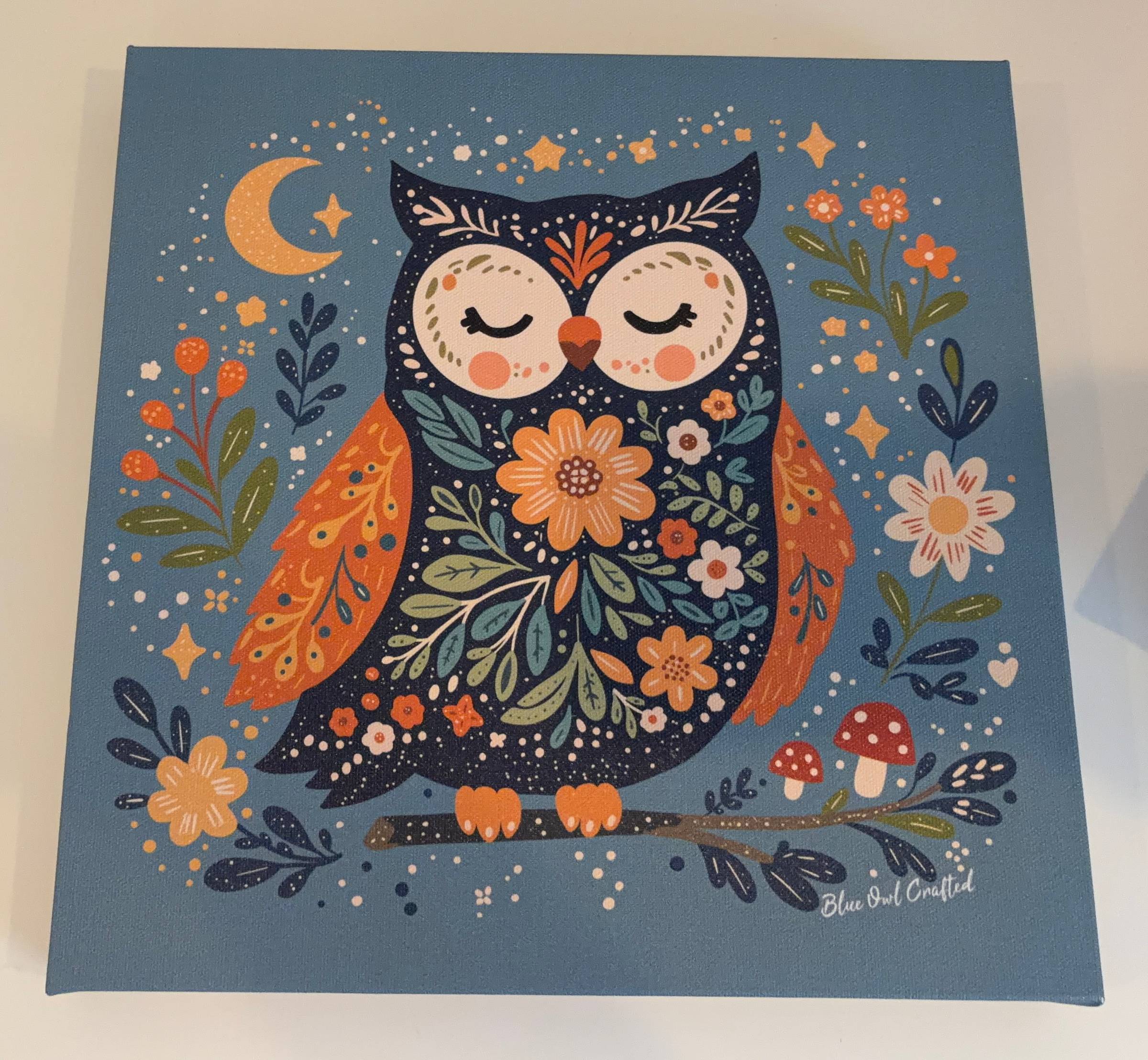 Hand drawn folk art owl canvas print with a richly patterned body blue background, from the Blue Owl Crafted Woodland Friends collection.