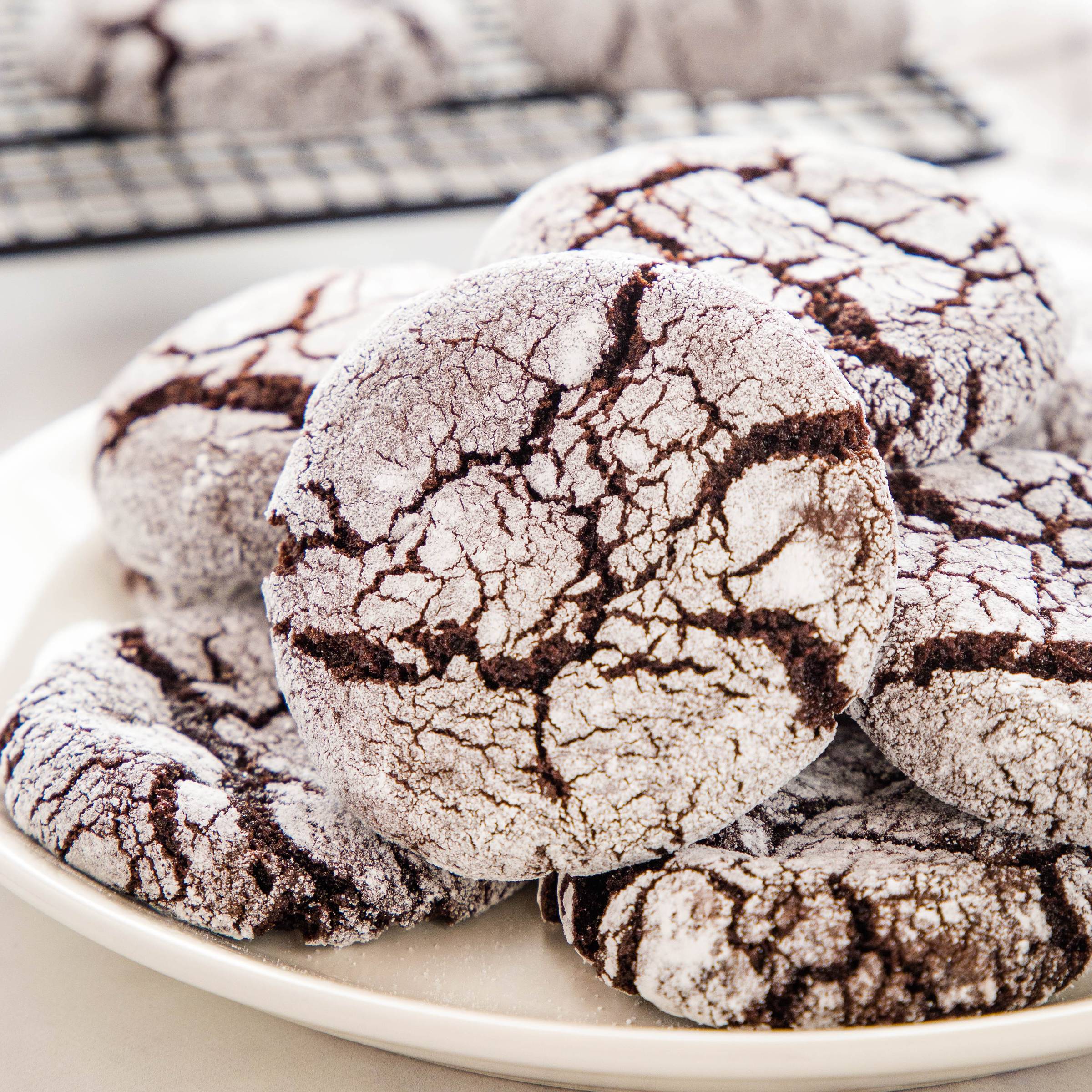 plate full of chocolate crinkle cookies