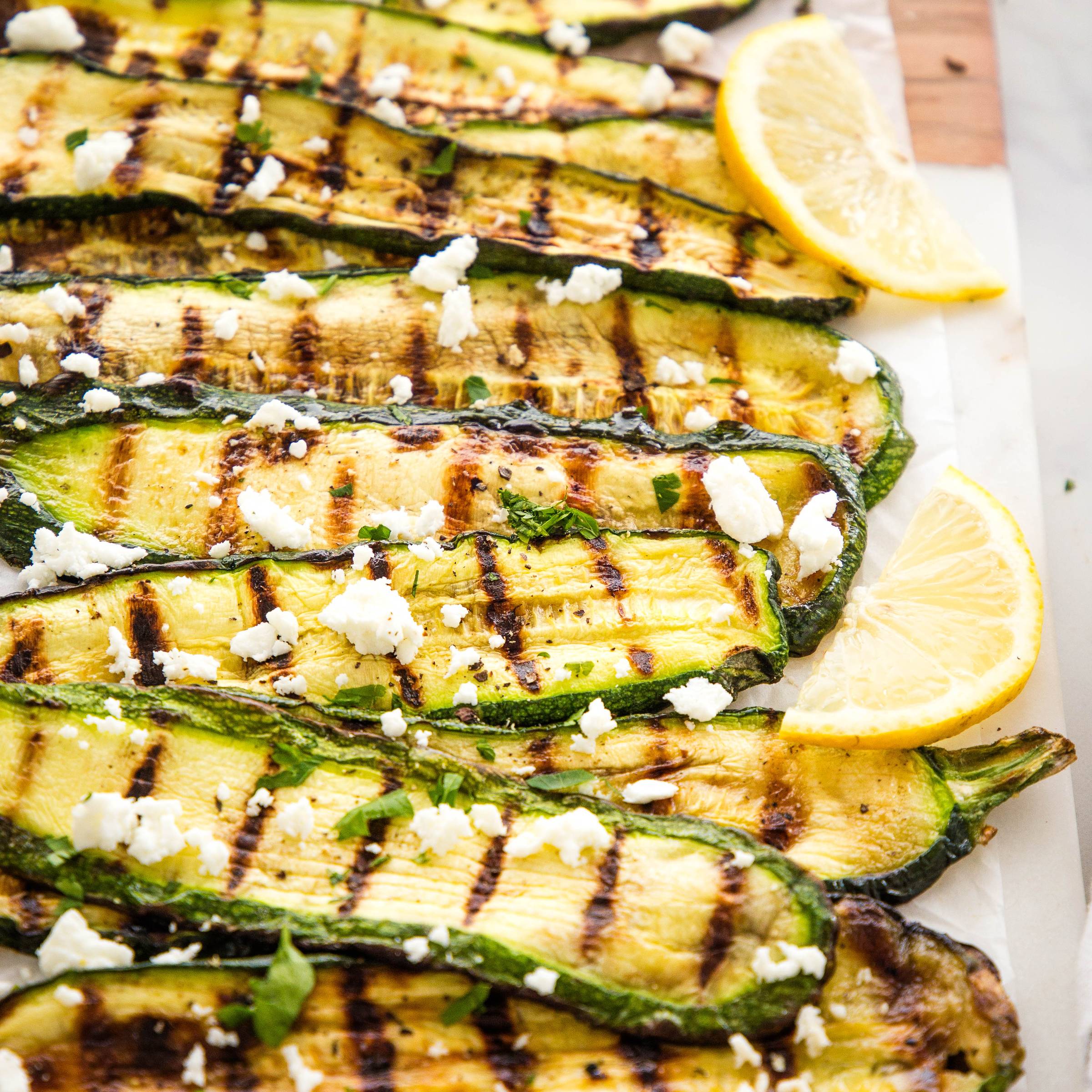 Grilled Zucchini topped with fresh herbs and feta