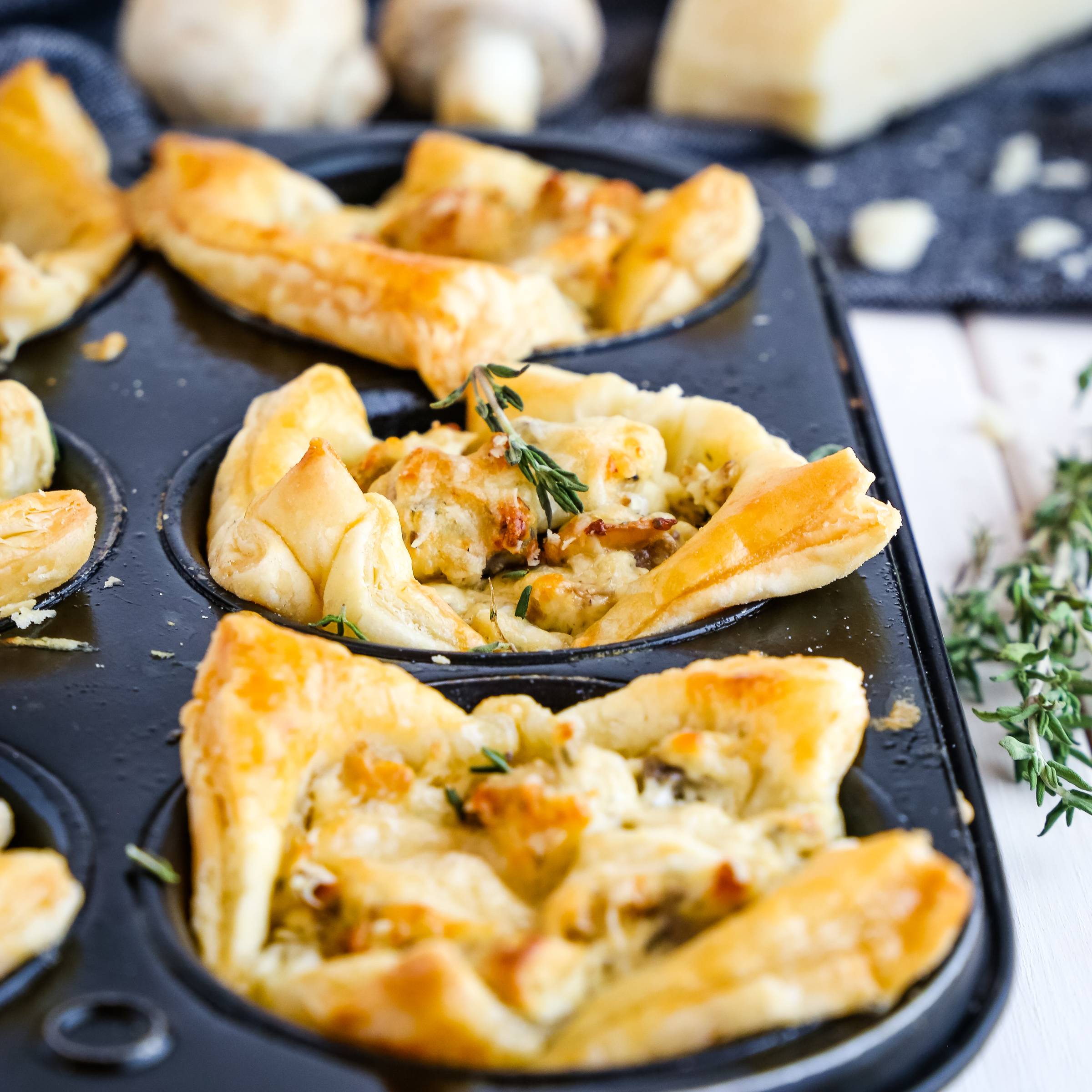 Creamy Parmesan Mushroom Cups in a muffin tin