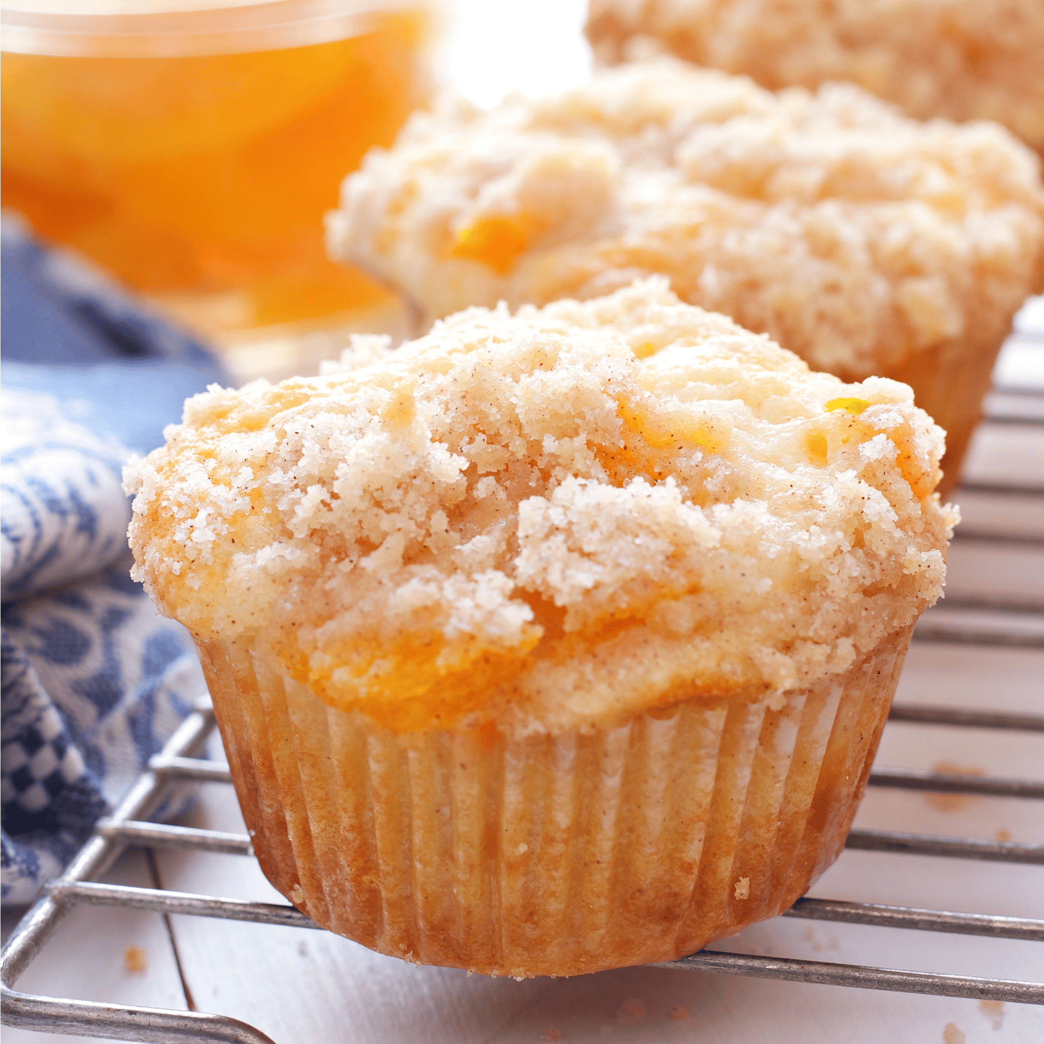 Peach cobbler muffin with streusel topping