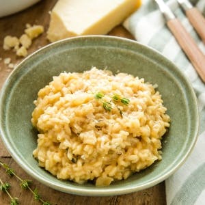 bowl of easy risotto topped with Parmesan cheese 