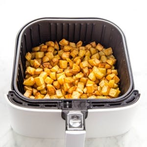 Air Fryer Basket with Breakfast Potatoes