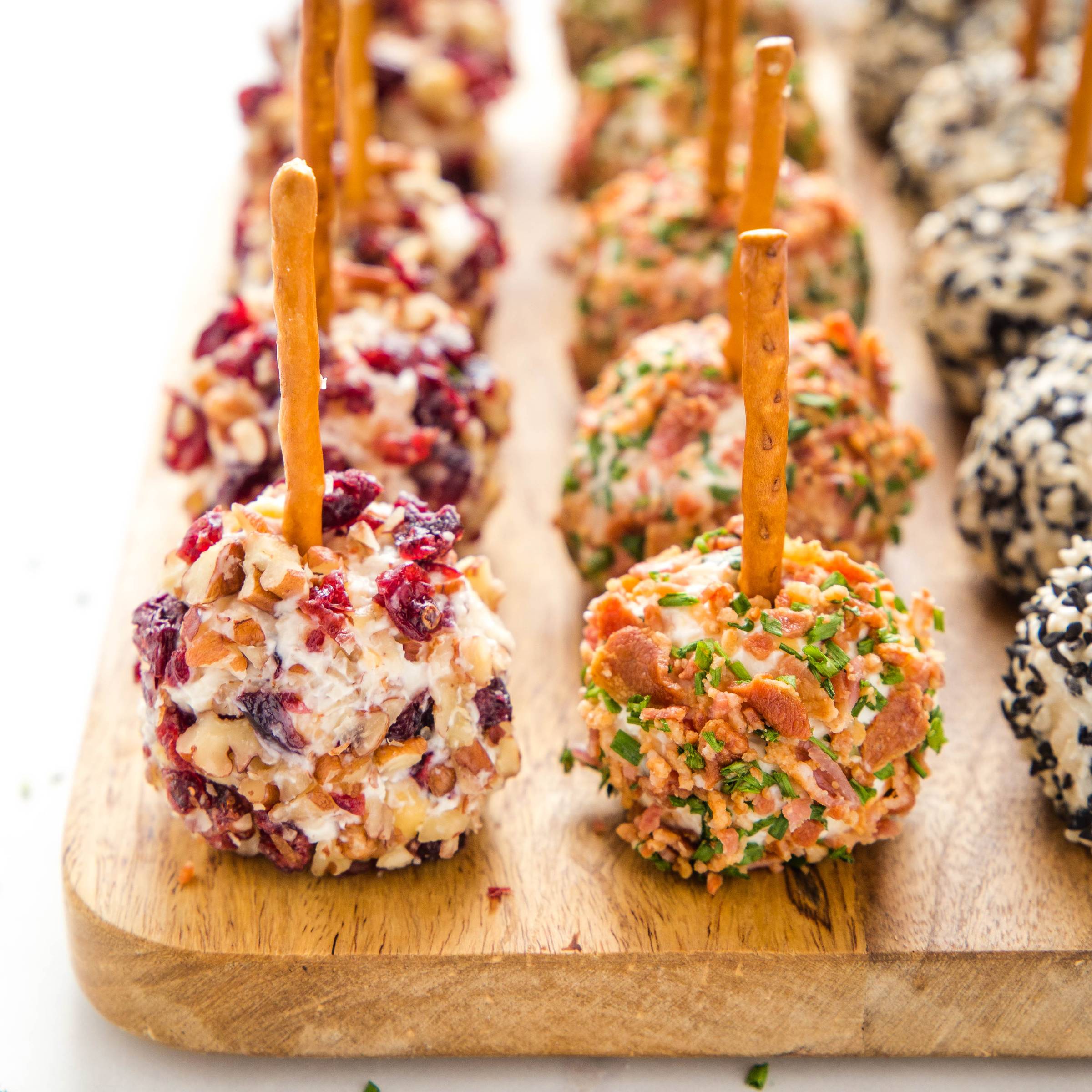 mini cheese balls on a serving board