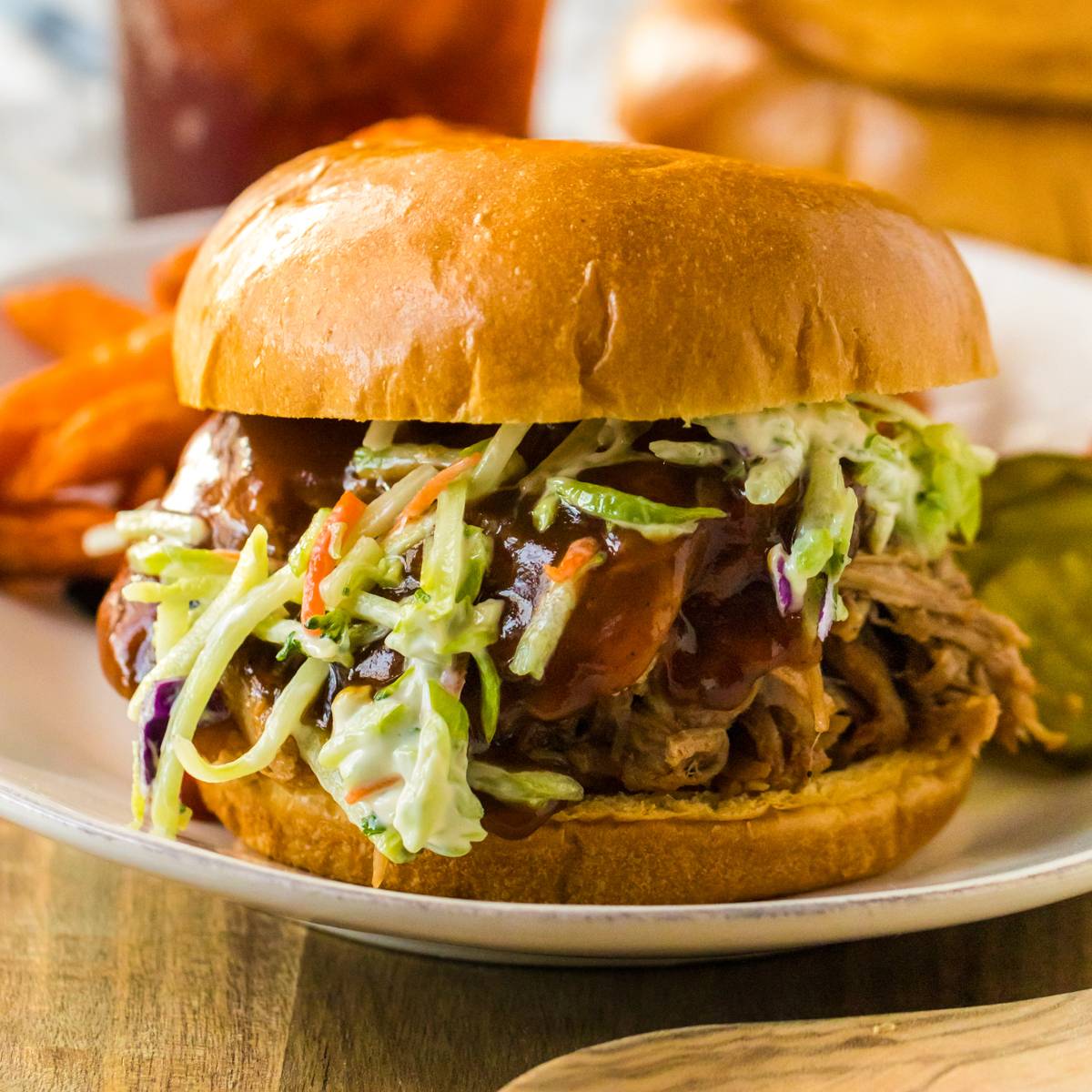 Pulled pork with BBQ sauce and cole slaw on bun.