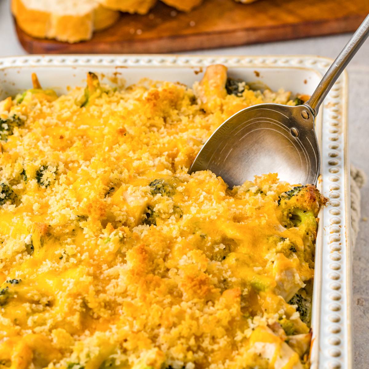 Chicken divan made with chicken and broccoli in a cheesy sauce topped with bread crumbs.