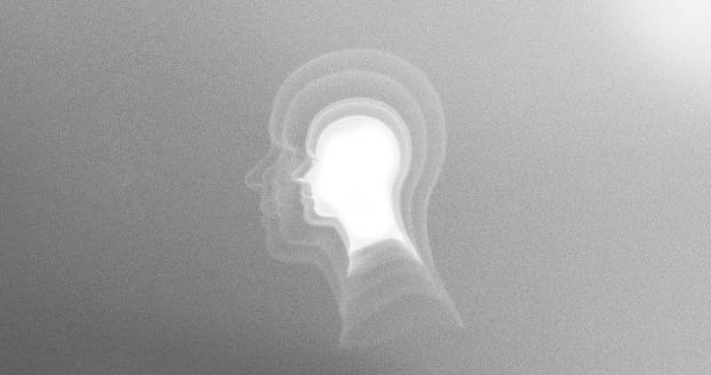 Silhouette of a head with layered outlines.