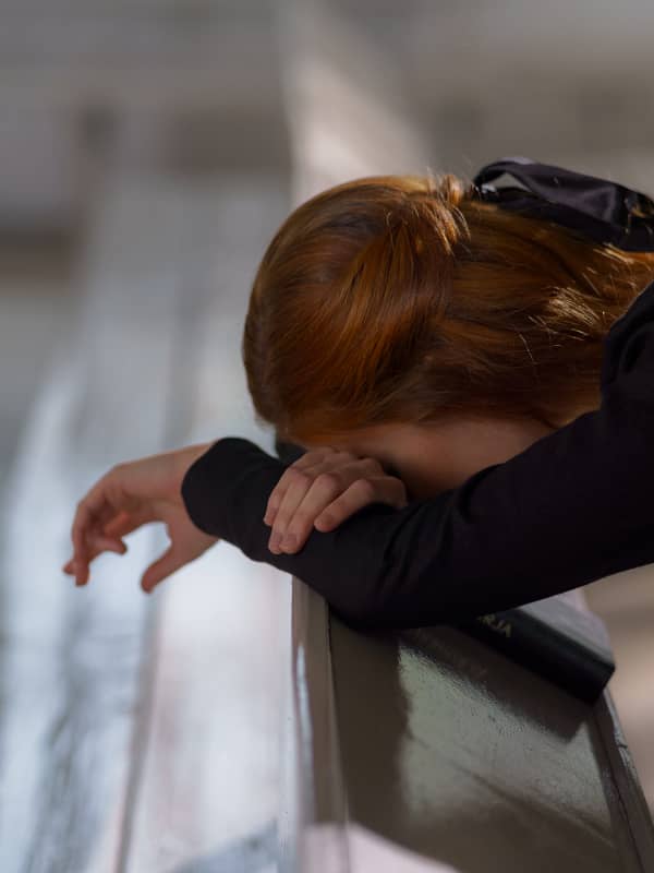 Woman bowing at the altar.