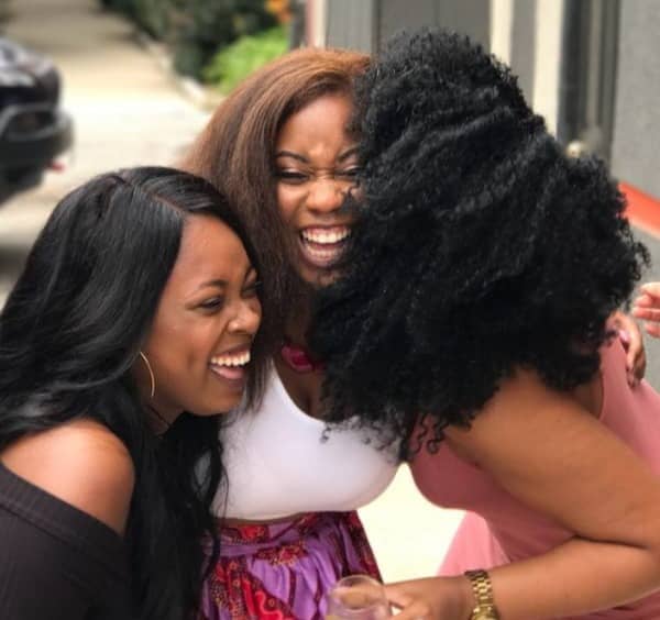 Three Women hugging and laughing.