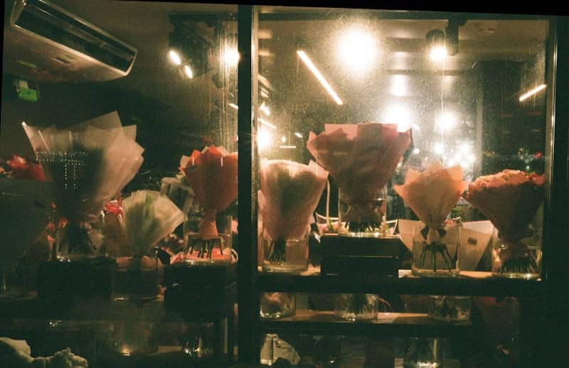 Bouquets of flowers displayed in a shop window
