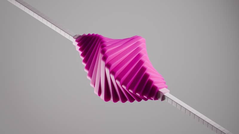 Pink pleated fabric twisted on a white rod