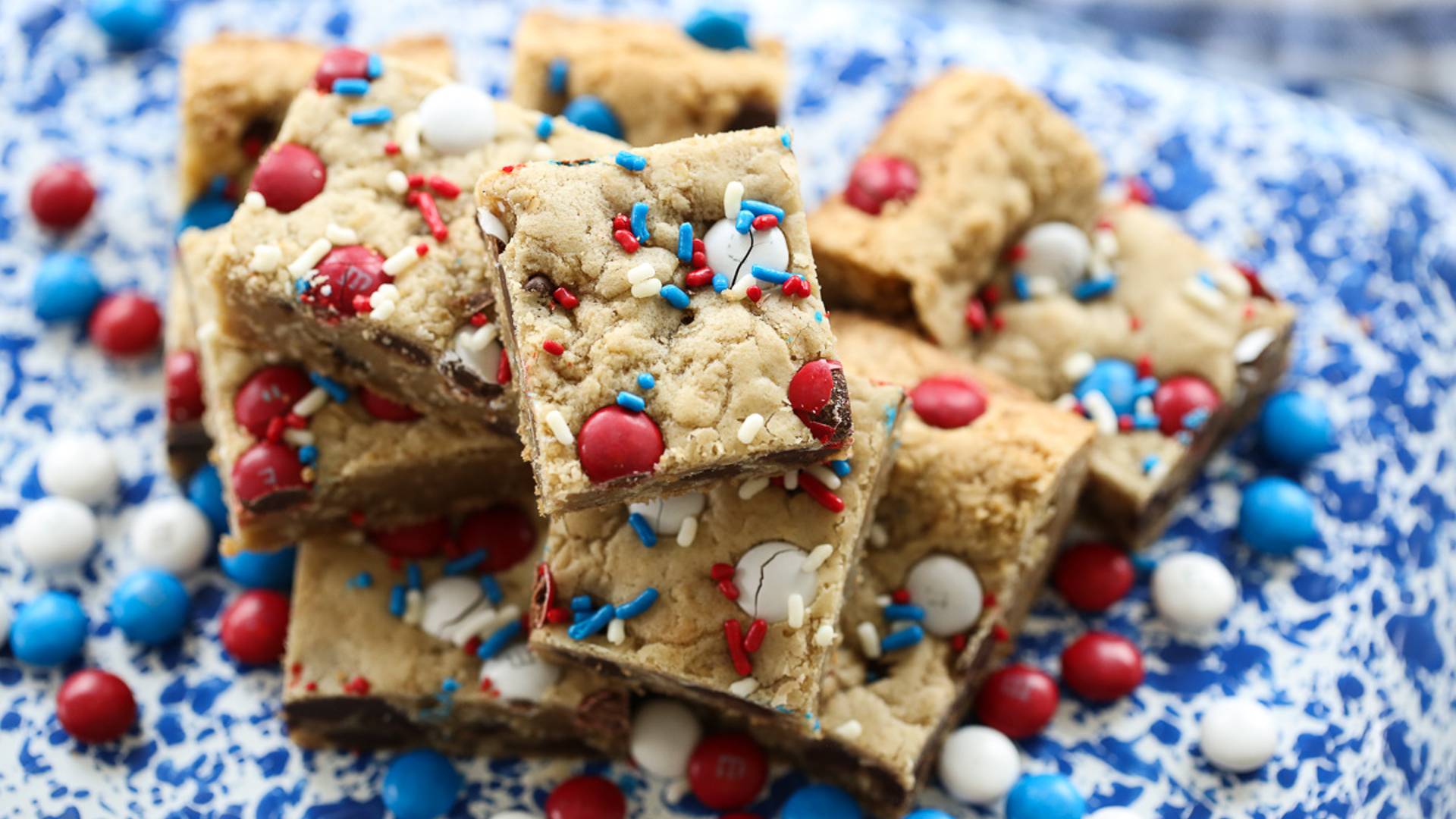 pile of cookie bars on a speckled plate
