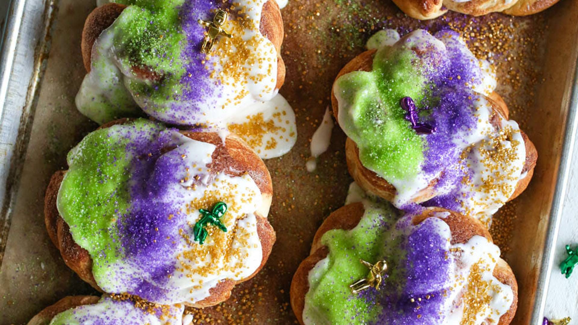 king cakes with sprinkles and plastic babies