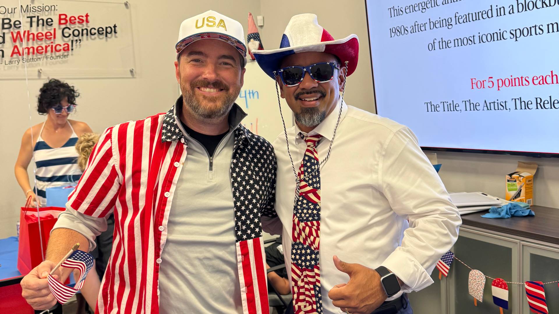 Pete Shau and Adam Sutton posing for a picture in red, white, and blue