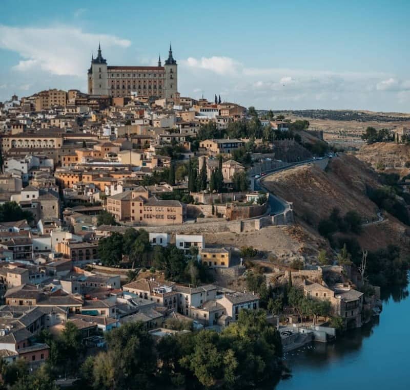 Historic city of toledo with alcázar and river tajo