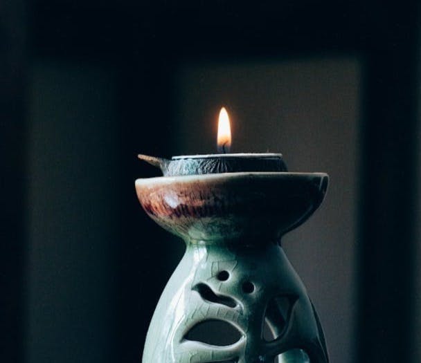 rule of thirds photography of lit candle