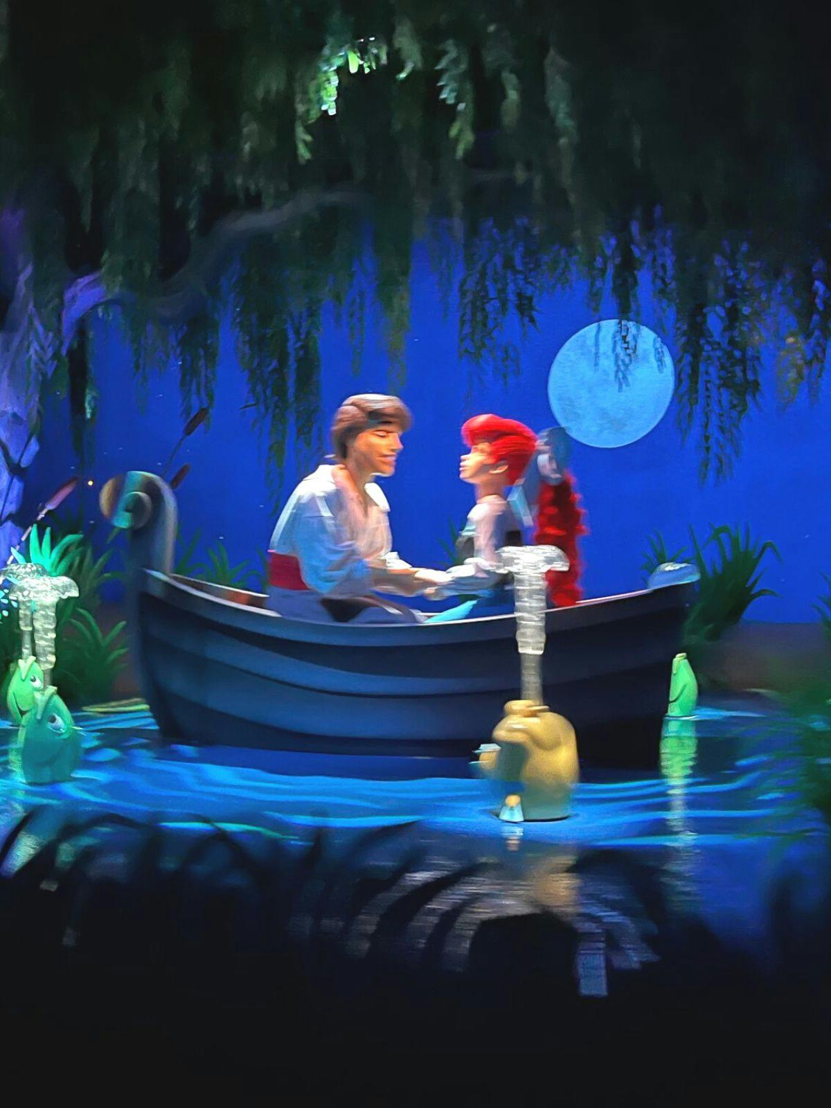 prince eric and ariel in a boat