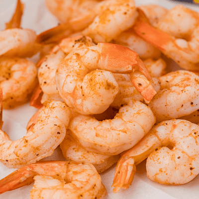 a pile of steamed shrimp with Old Bay seasoning