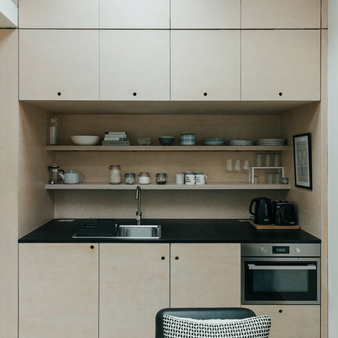 Kitchen recessed in service core