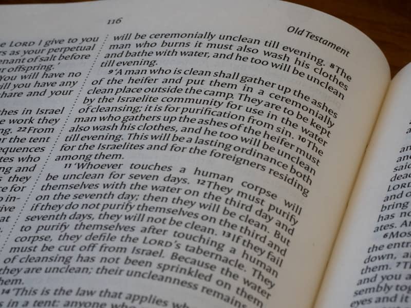 Pages of an open bible with printed text.
