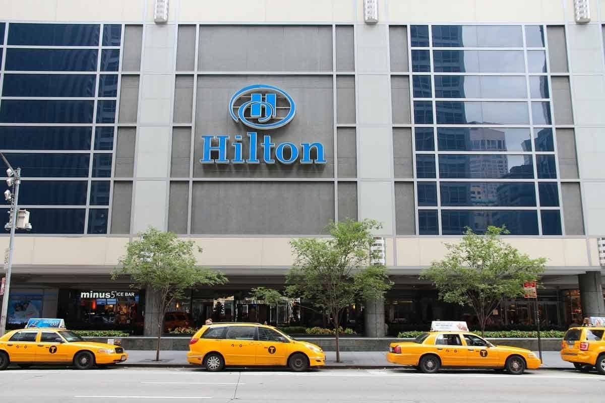 A line of yellow taxis wait outside the Hilton New York.
