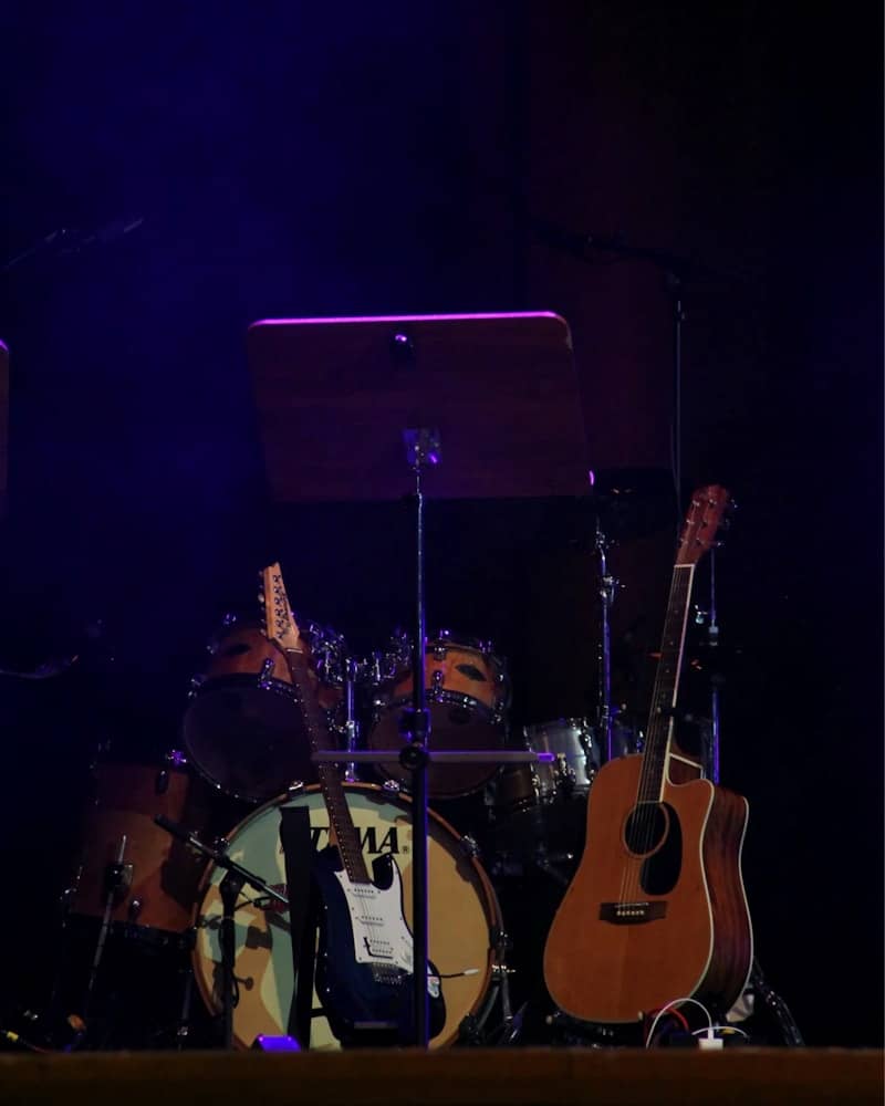 A group of guitars sitting on top of a stage