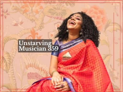 Episode artwork with the title "Unstarving Musician 360: Indian Classical Vocalist Crossover Artist – Roopa Mahadevan (Revisited)" in white text on purple. Roopa laughs with her head tilted back, wearing a red sari with a blue and gold border, seated agai