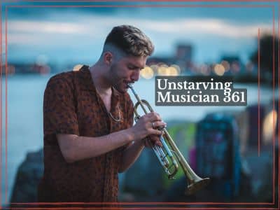 Noam Bargil playing trumpet outdoors at dusk in a brown patterned shirt, with blurred city lights across the water behind him and a thin red border around the photo.