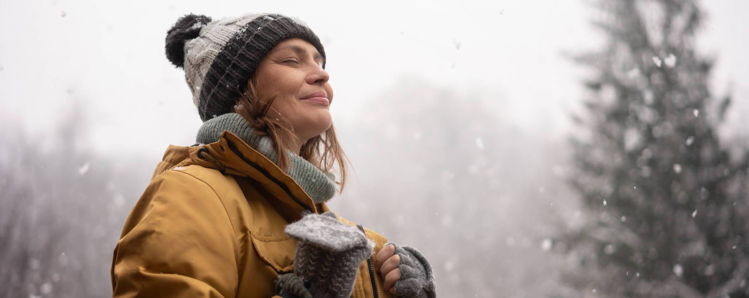 woman happy outside in a wintry day