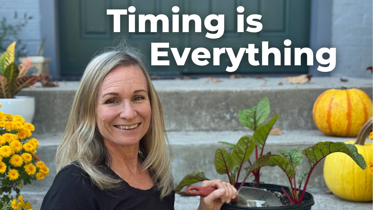 smiling woman holding a trowel