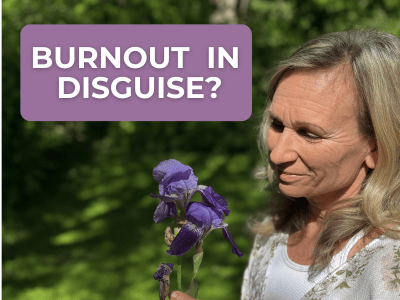 woman gazing at purple iris