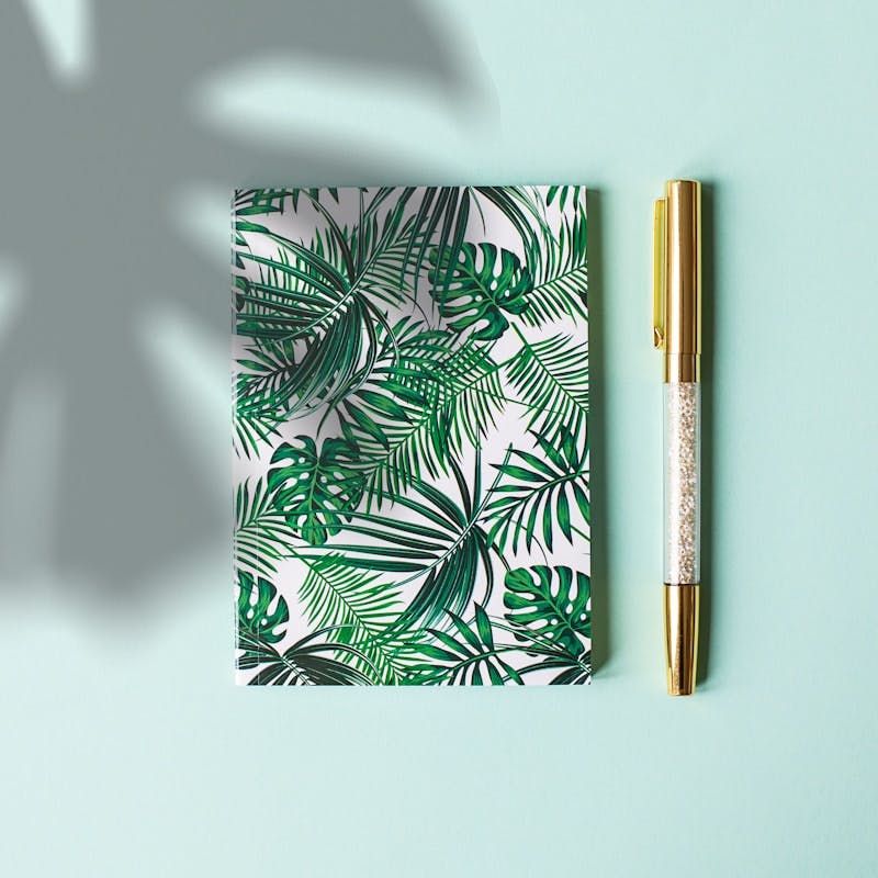 green floral covered notebook