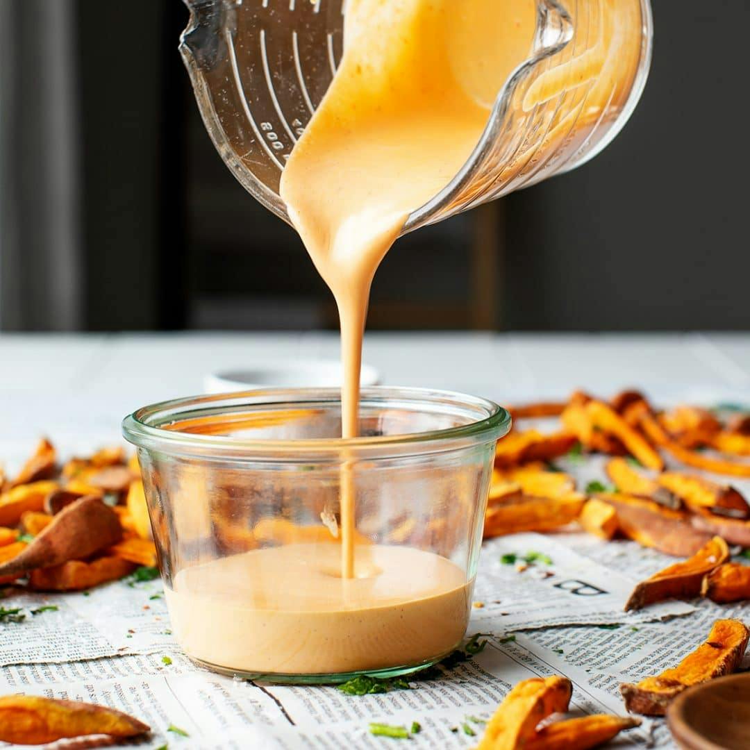 Pouring chipotle sauce into jar