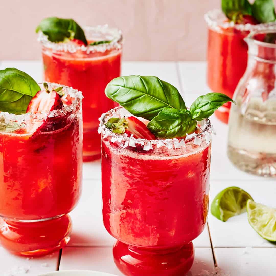 Three strawberry margaritas with basil