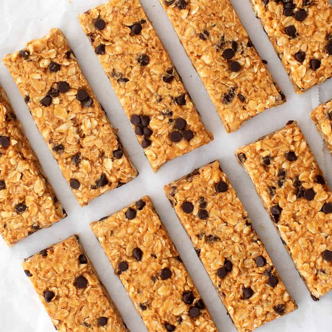 Chocolate chip granola bars on white parchment paper