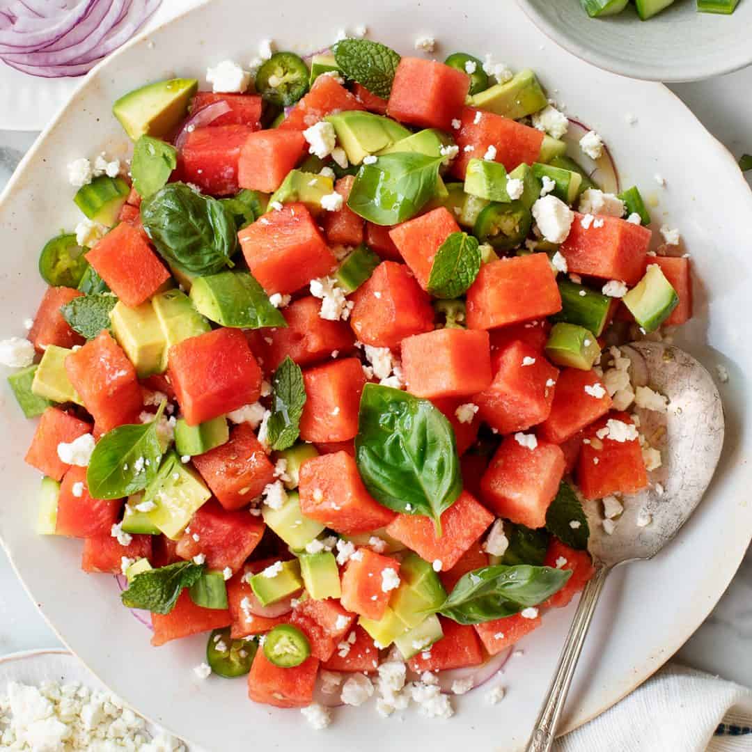 Watermelon salad with feta, avocado, and fresh herbs