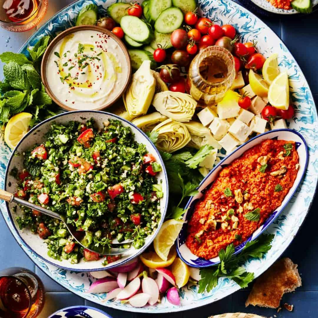 Mezze platter with tabbouleh, whipped feta, muhammara, and fresh veggies