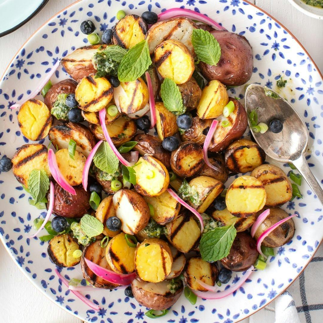 Grilled potatoes with pickled onions and mint