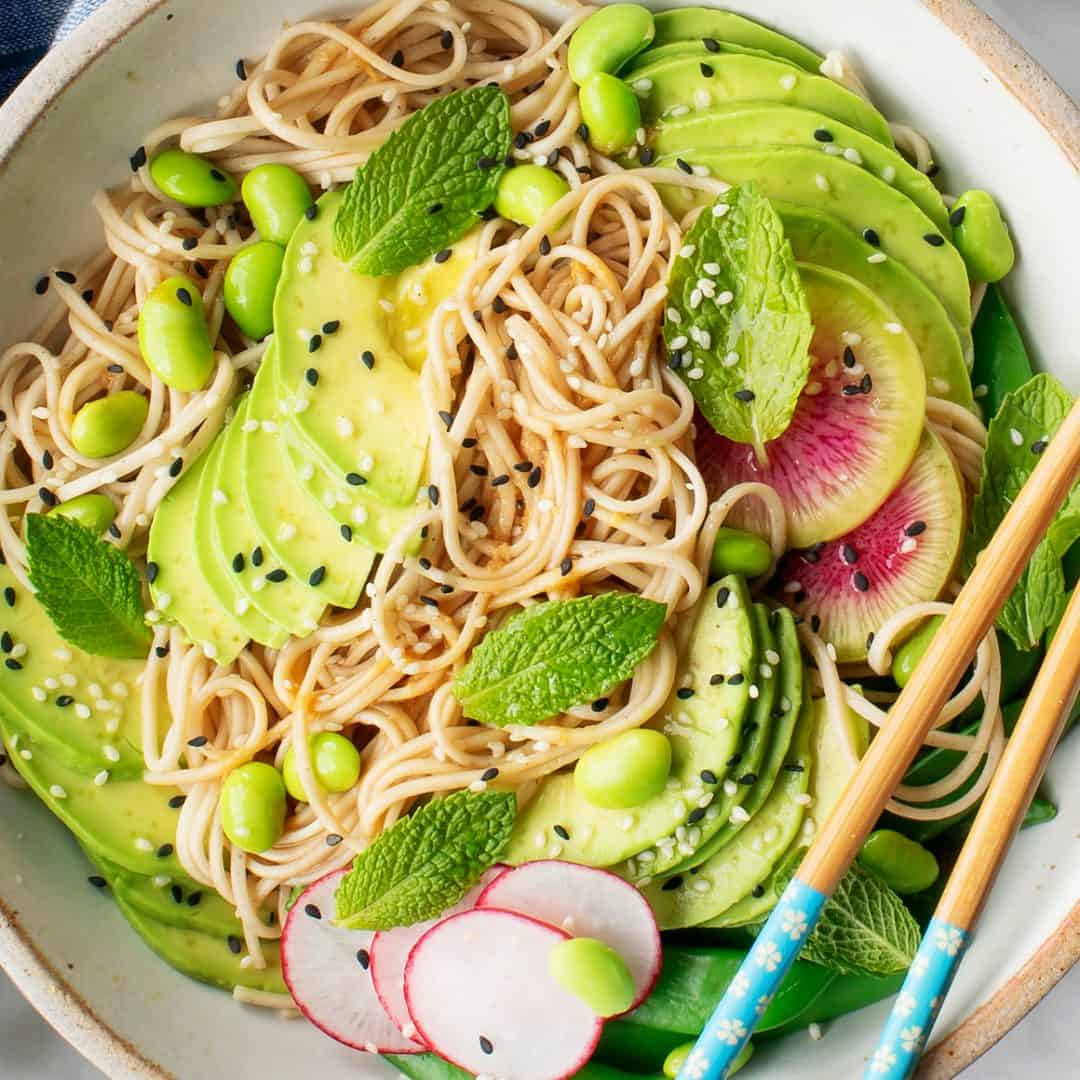 Sesame soba noodles with avocado, herbs, radishes, and snap peas