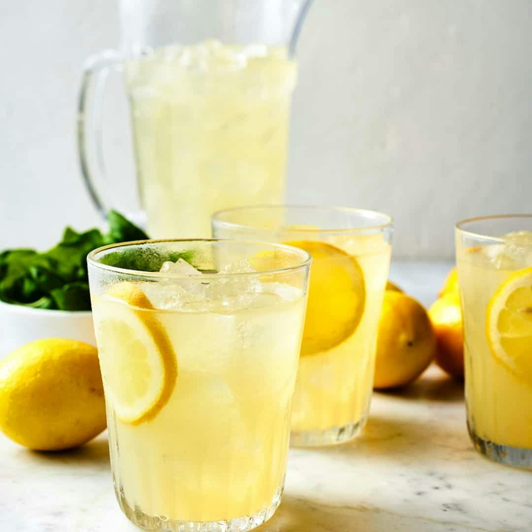 Three glasses of homemade lemonade with lemon wheels