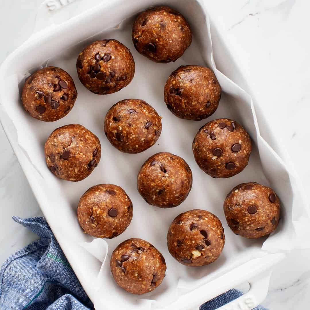 Energy balls in parchment-lined baking dish