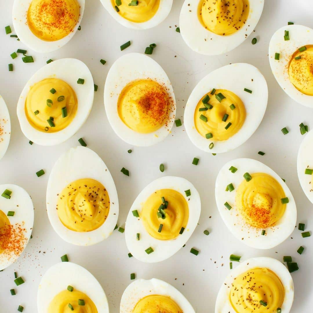 Deviled eggs with chives, smoked paprika, and celery seeds