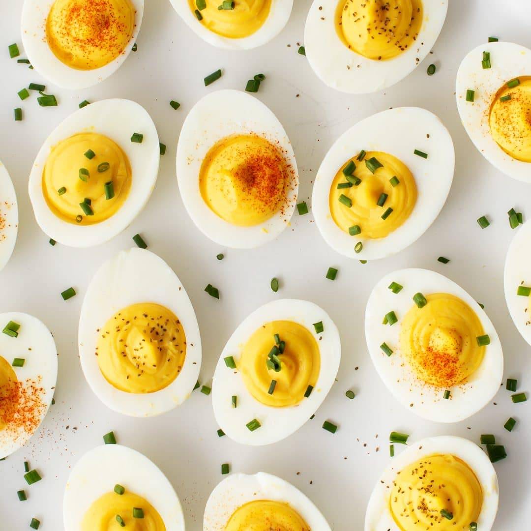 Deviled eggs with chives, smoked paprika, and celery seeds