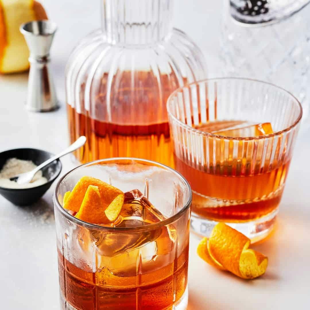 Old fashioned cocktail garnished with orange twist
