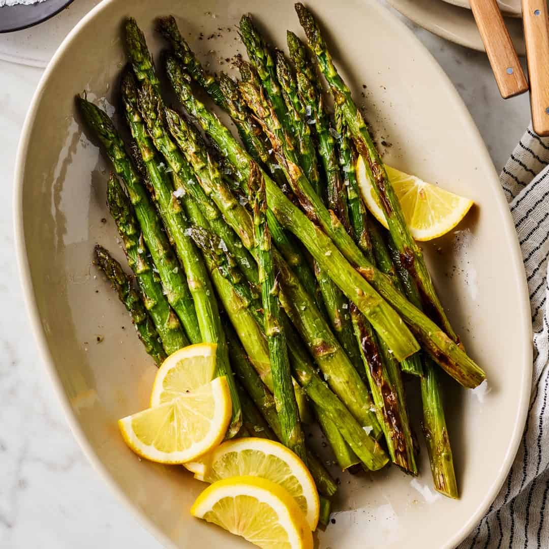 Roasted asparagus with lemon wedges