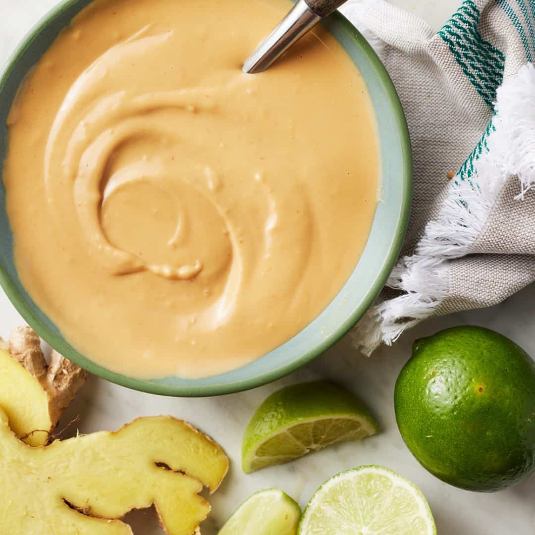 Bowl of peanut sauce with spoon