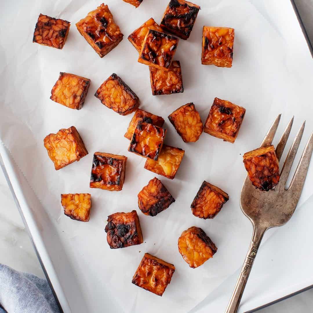 Baked tempeh on a baking sheet
