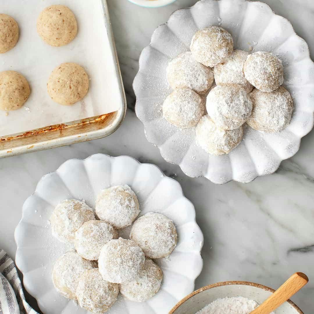 Mexican wedding cookies on two plates