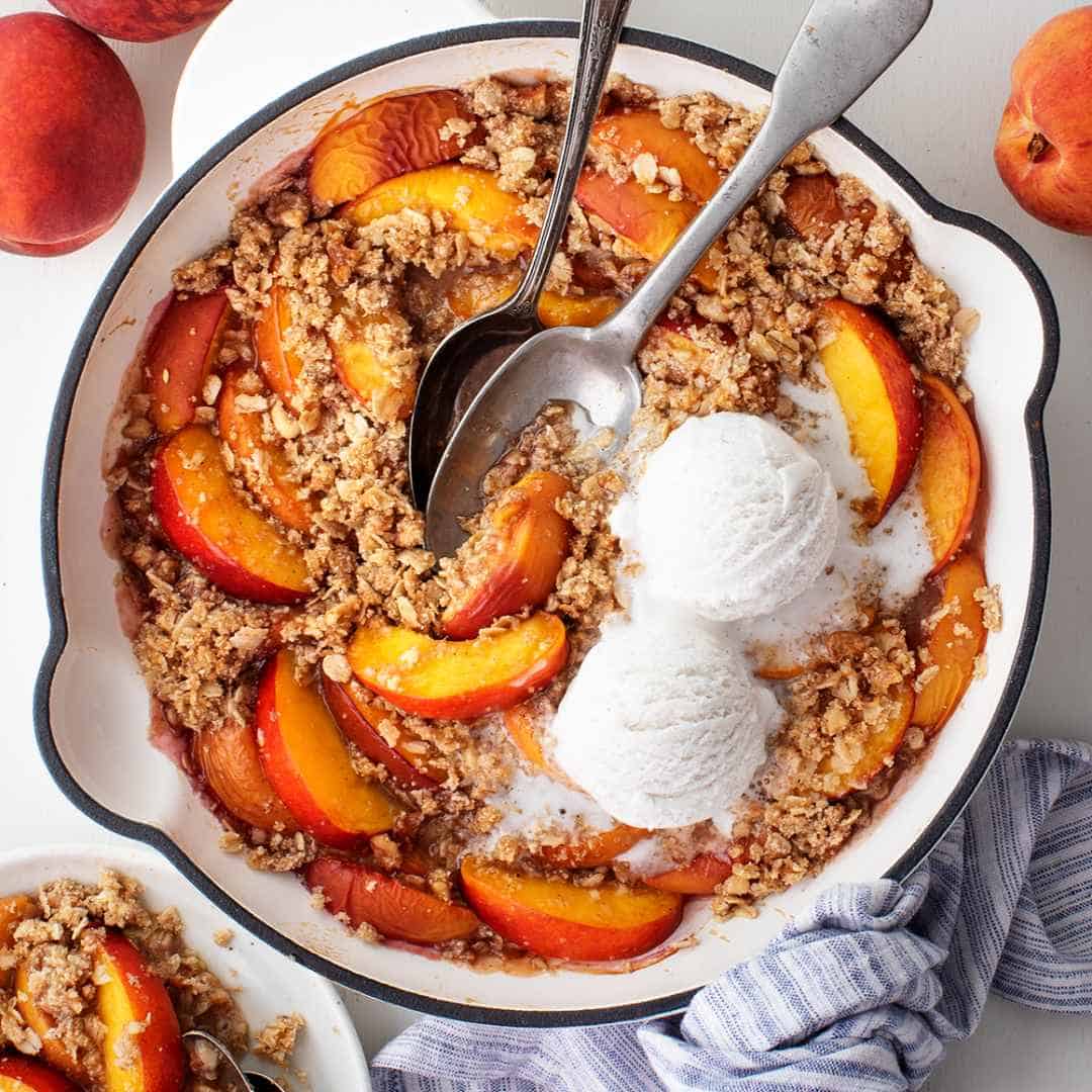 Skillet peach crisp with vanilla ice cream